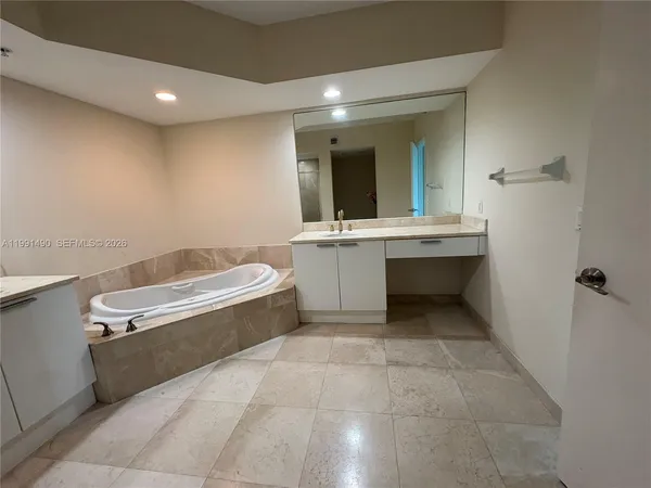 a bathroom with a sink a toilet and bathtub