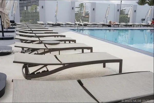 a view of kitchen with kitchen island and a window