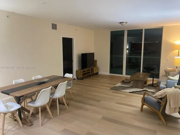 a view of a livingroom with furniture and window