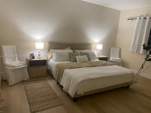 a bedroom with a bed and a couch