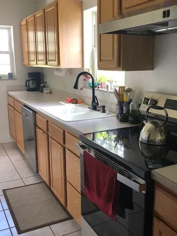 a living room with furniture and a closet