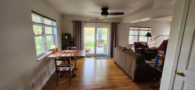 a view of a backyard with a wooden fence