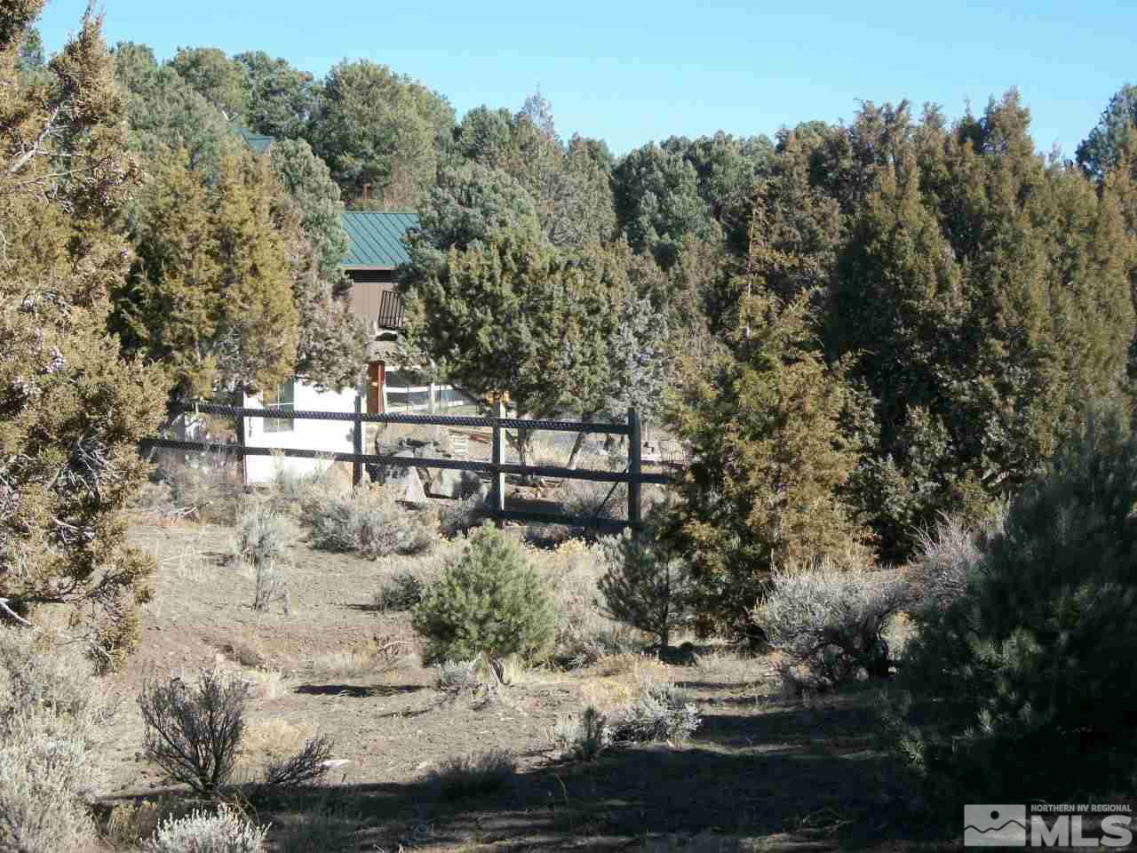 2421 Enterprise Road, Unit 58 Reno, NV 89521 - Photo 11 of 12 a view of a yard with large trees