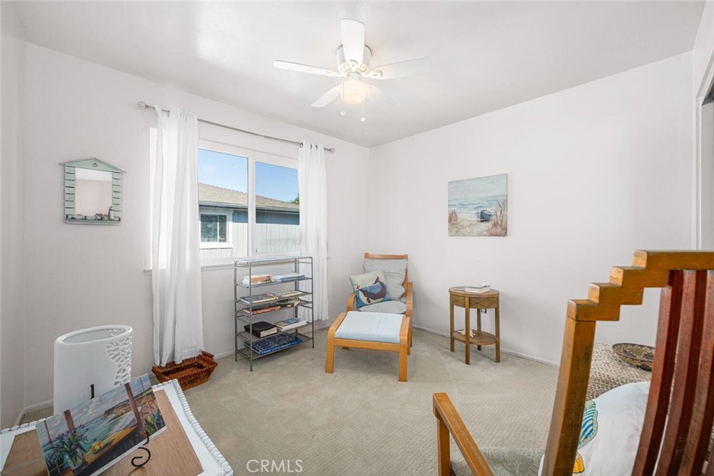 16393 Del Oro Circle, Unit 123 Huntington Beach, CA 92649 - Photo 16 of 24 a bedroom with furniture and a window