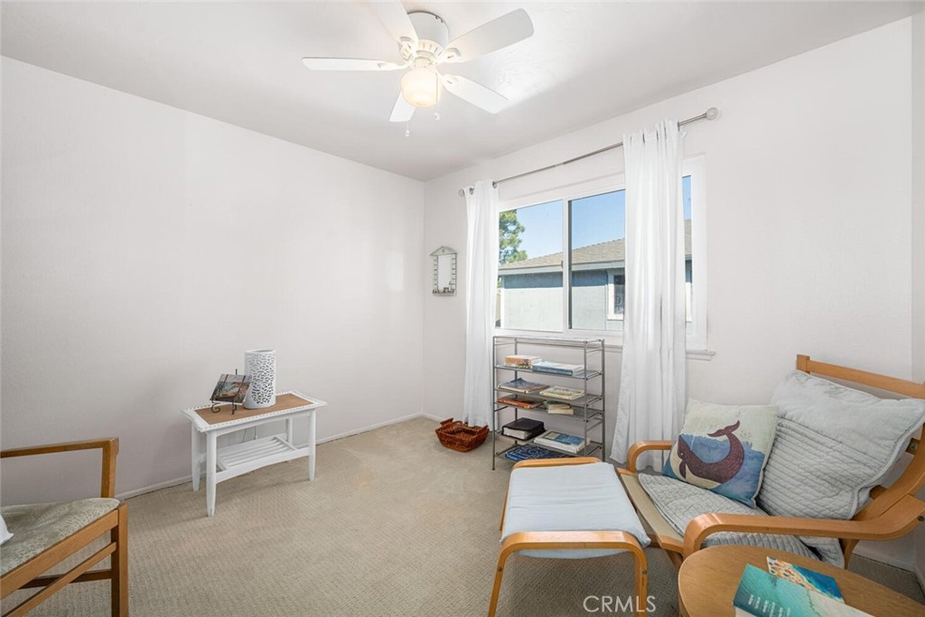 16393 Del Oro Circle, Unit 123 Huntington Beach, CA 92649 - Photo 18 of 24 a bedroom with furniture and a window