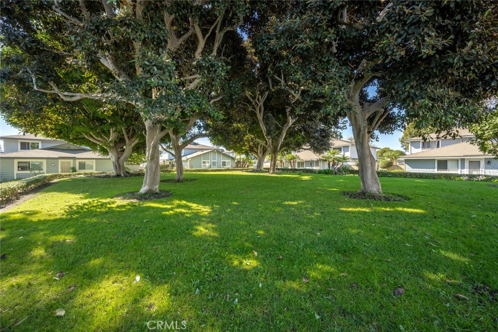 16393 Del Oro Circle, Unit 123 Huntington Beach, CA 92649 - Photo 24 of 24 a view of a house with a backyard