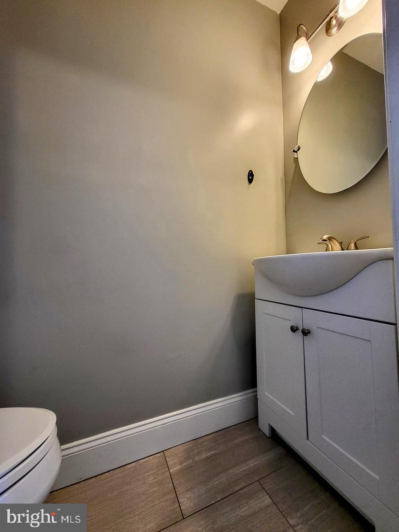 2237 Federal Street Philadelphia, PA 19146 - Photo 12 of 25 a bathroom with a sink mirror and toilet