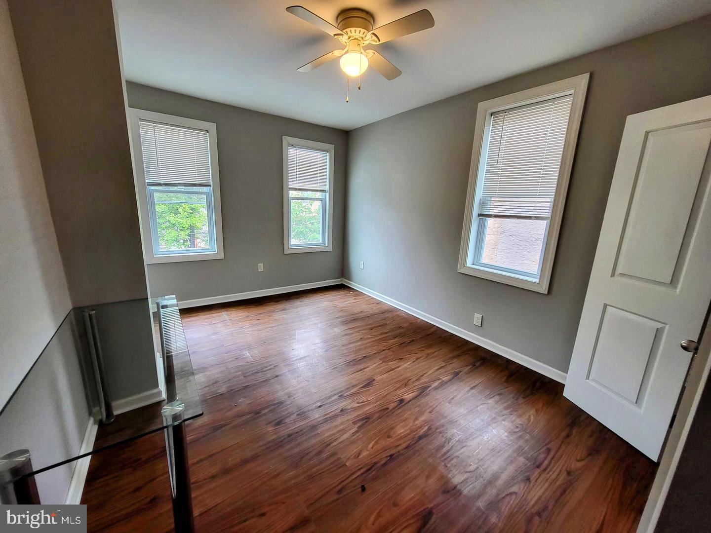 2237 Federal Street Philadelphia, PA 19146 - Photo 17 of 25 a view of an empty room with wooden floor and a window