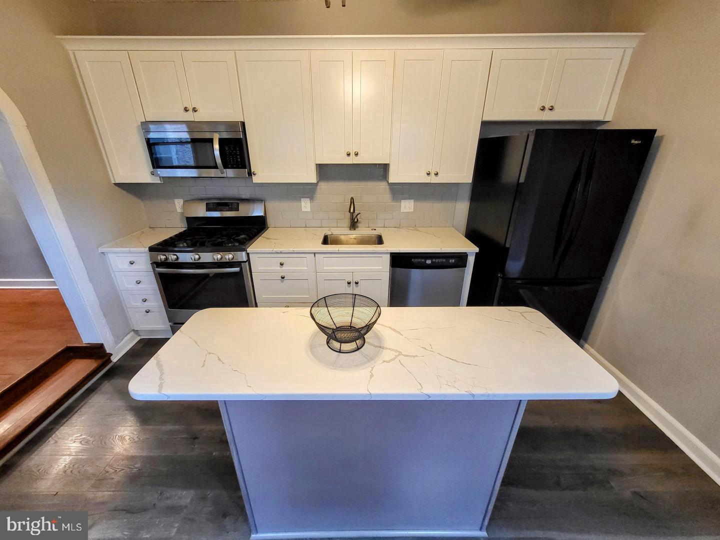 2237 Federal Street Philadelphia, PA 19146 - Photo 9 of 25 a kitchen with stainless steel appliances a stove refrigerator sink and microwave
