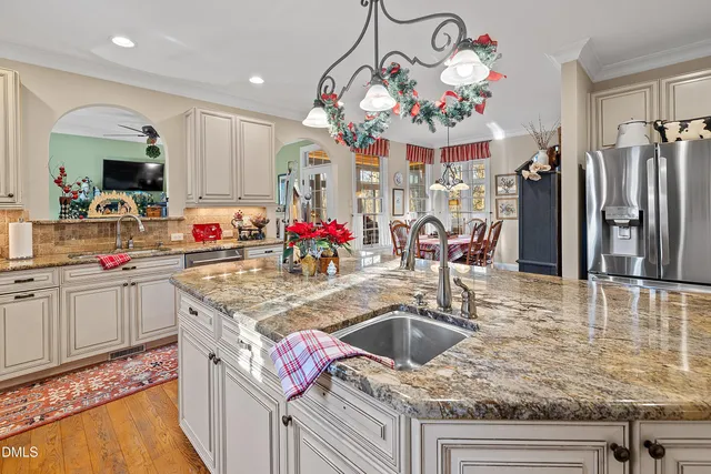 a living room filled with furniture and a large window