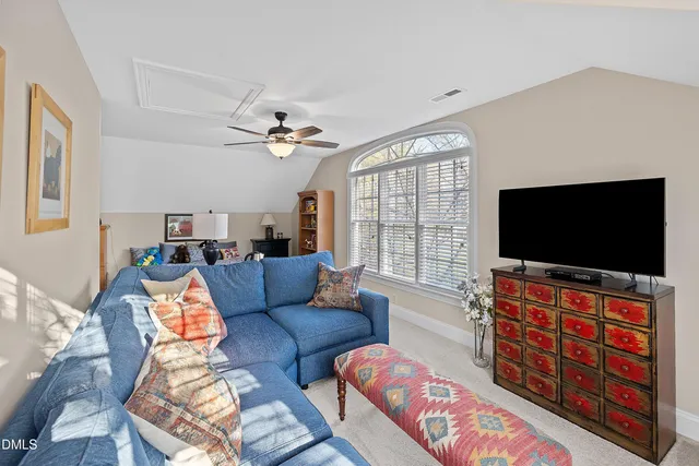 a view of a house with a door and wooden bench