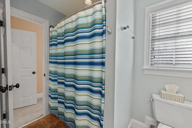 a view of park with trees in the background