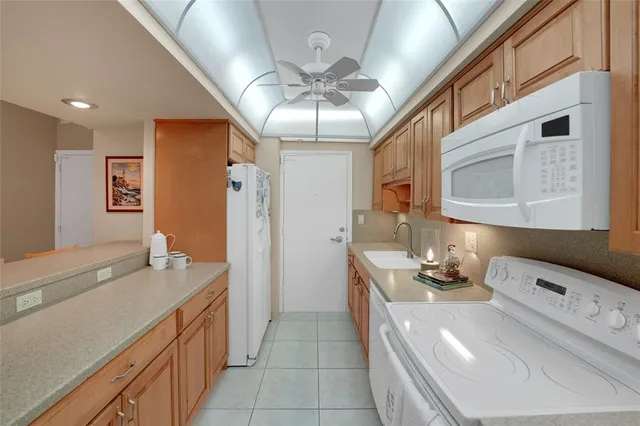 a bathroom with a sink a large mirror and a shower