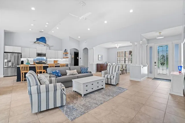 a living room with furniture and a fireplace