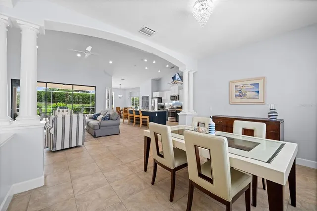 a kitchen with stainless steel appliances granite countertop a stove top oven a sink dishwasher a refrigerator and a stove