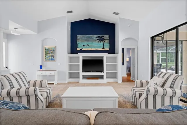 a view of a dining room with furniture wooden floor and chandelier