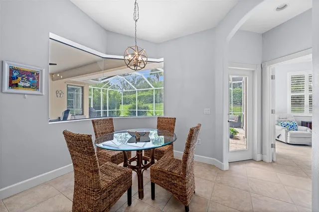 a spacious bedroom with a bed and glass window