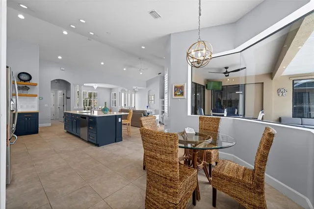 a bathroom with a sink toilet a mirror and window