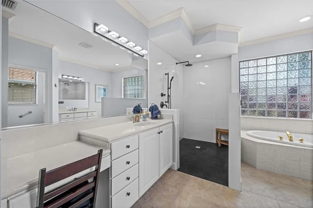 an aerial view of a house with a garden and lake view