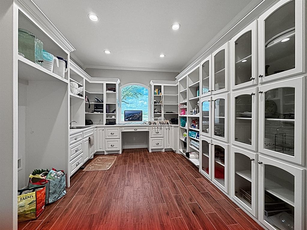 909 Higginbotham Lane China Spring, TX 76633 - Photo 11 of 40 a kitchen with stainless steel appliances wooden floors and wooden cabinets