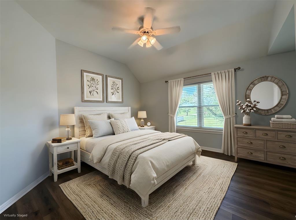 909 Higginbotham Lane China Spring, TX 76633 - Photo 17 of 40 a bedroom with a large bed and a chandelier