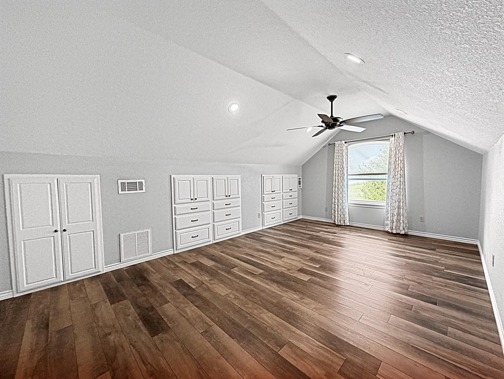 909 Higginbotham Lane China Spring, TX 76633 - Photo 24 of 40 a view of empty room with wooden floor and fan
