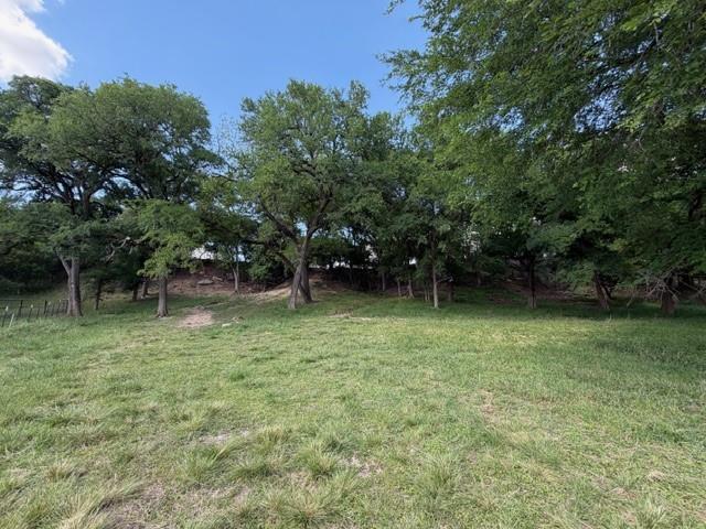 909 Higginbotham Lane China Spring, TX 76633 - Photo 34 of 40 a backyard of a house with lots of green space