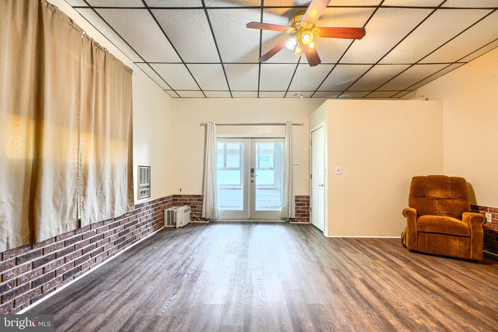 2215 Lodge Farm Road Baltimore, MD 21219 - Photo 21 of 38 Family Room with entrance to Sunroom