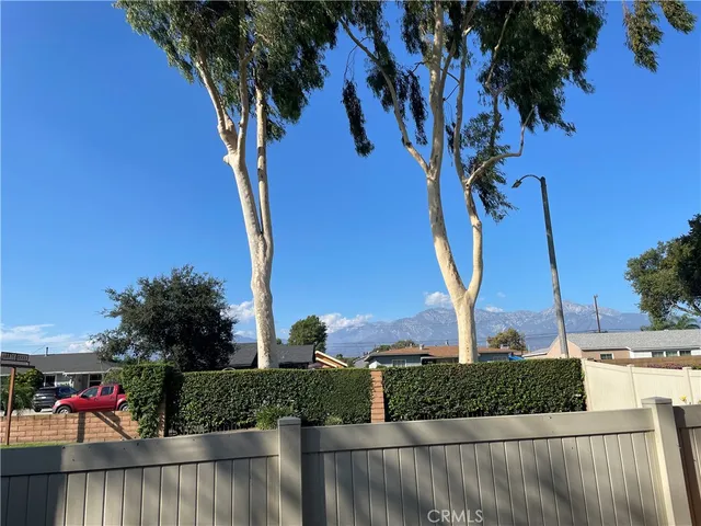 a view of balcony with wooden floor and outdoor seating
