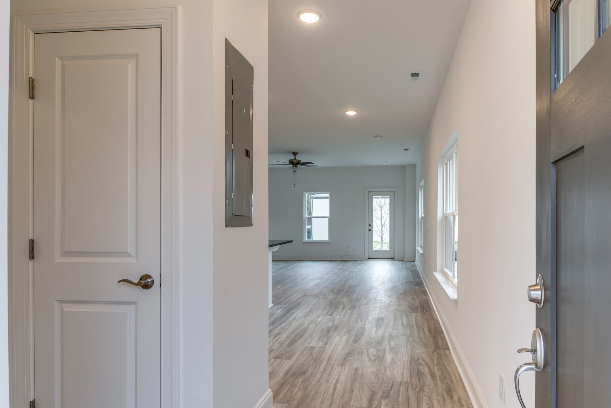 923 Southeast Broad Street, Unit B2 Murfreesboro, TN 37130 - Photo 12 of 32 a view of a hallway with wooden floor and a bathroom