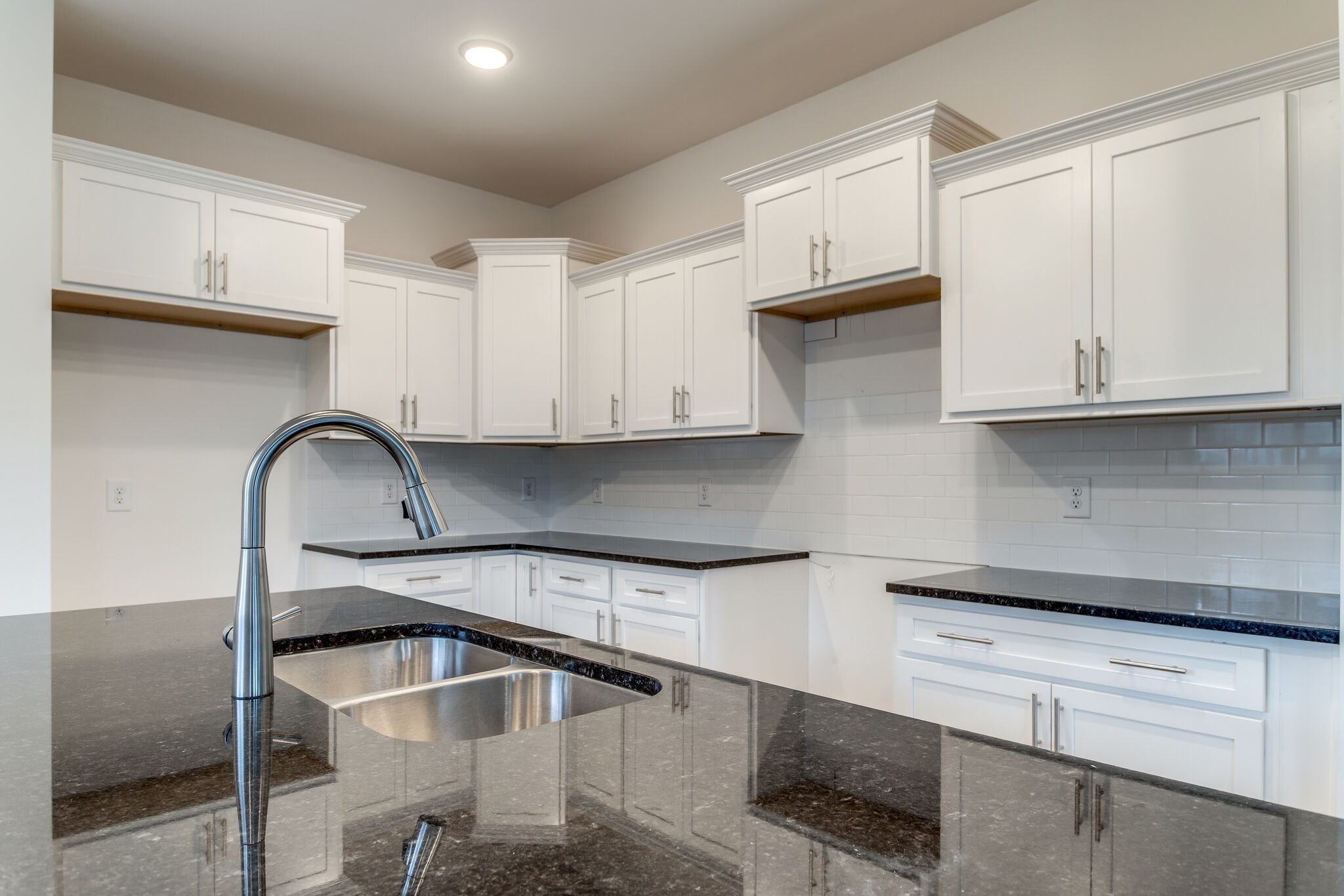 923 Southeast Broad Street, Unit B2 Murfreesboro, TN 37130 - Photo 17 of 32 a kitchen with stainless steel appliances granite countertop a sink and cabinets