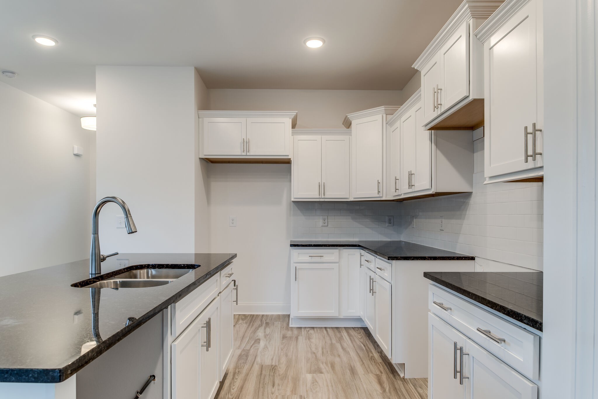 923 Southeast Broad Street, Unit B2 Murfreesboro, TN 37130 - Photo 18 of 32 a kitchen with white cabinets stainless steel appliances and sink
