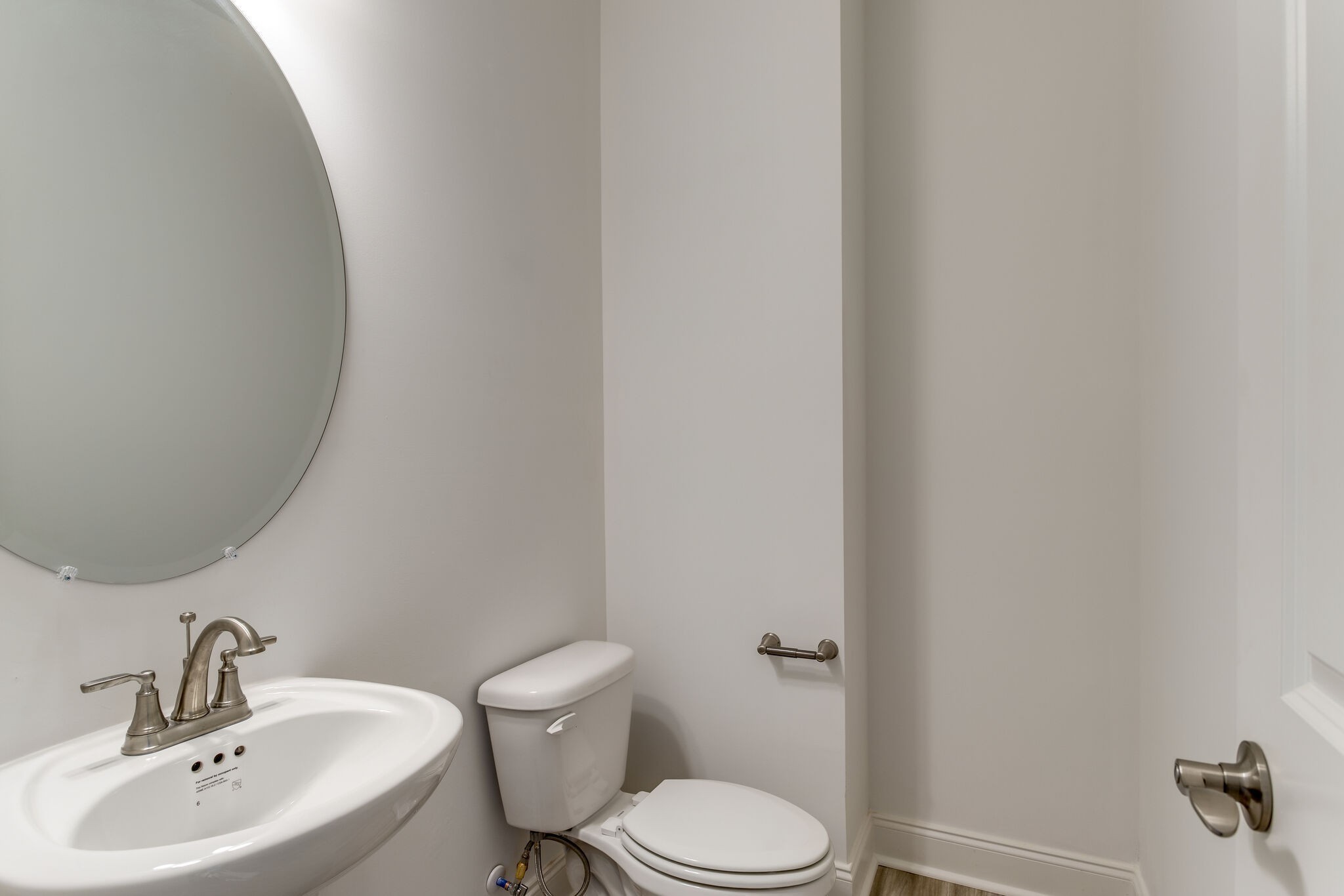 923 Southeast Broad Street, Unit B2 Murfreesboro, TN 37130 - Photo 21 of 32 a white toilet sitting next to a bathroom sink