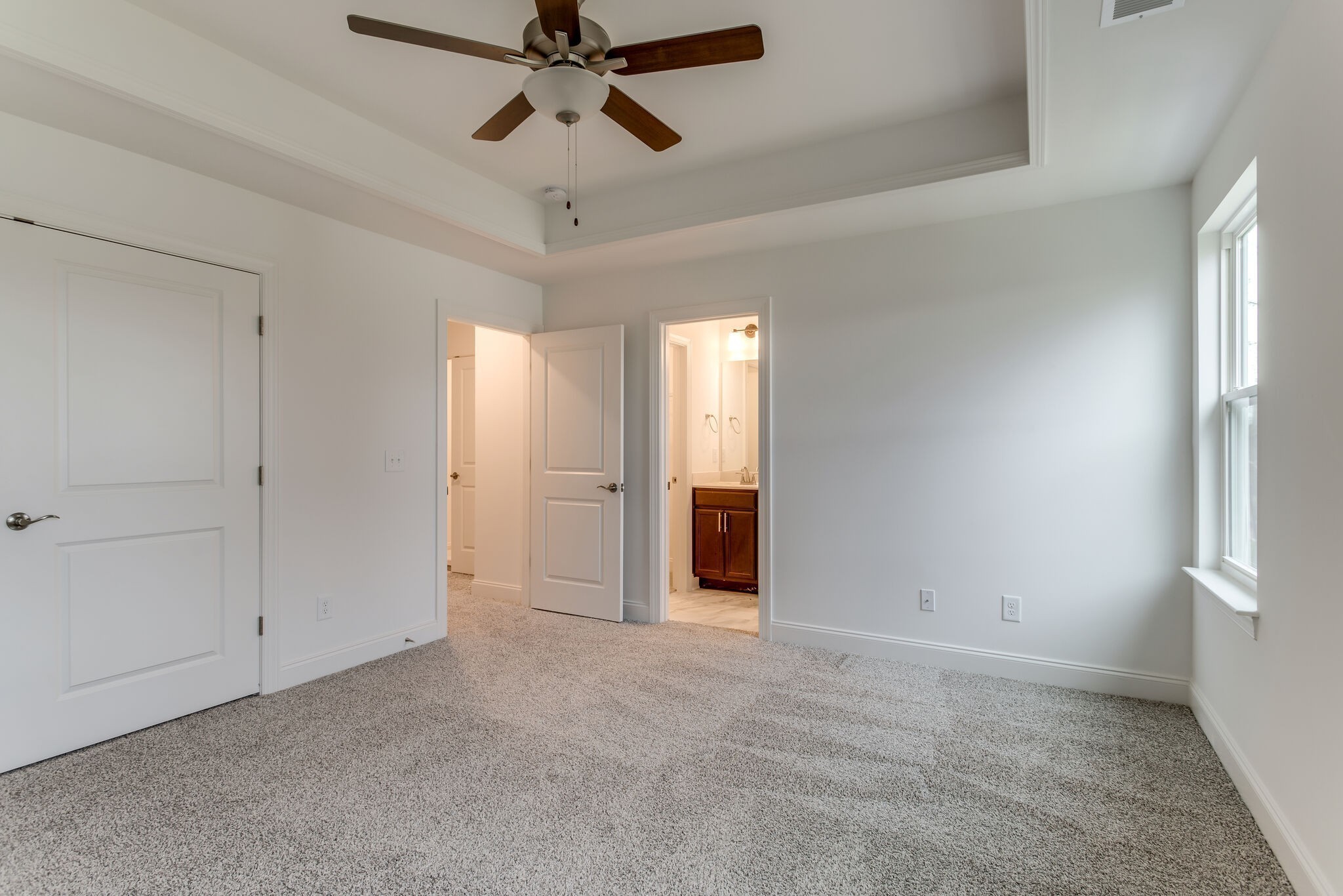 923 Southeast Broad Street, Unit B2 Murfreesboro, TN 37130 - Photo 26 of 32 a view of an empty room and chandelier fan
