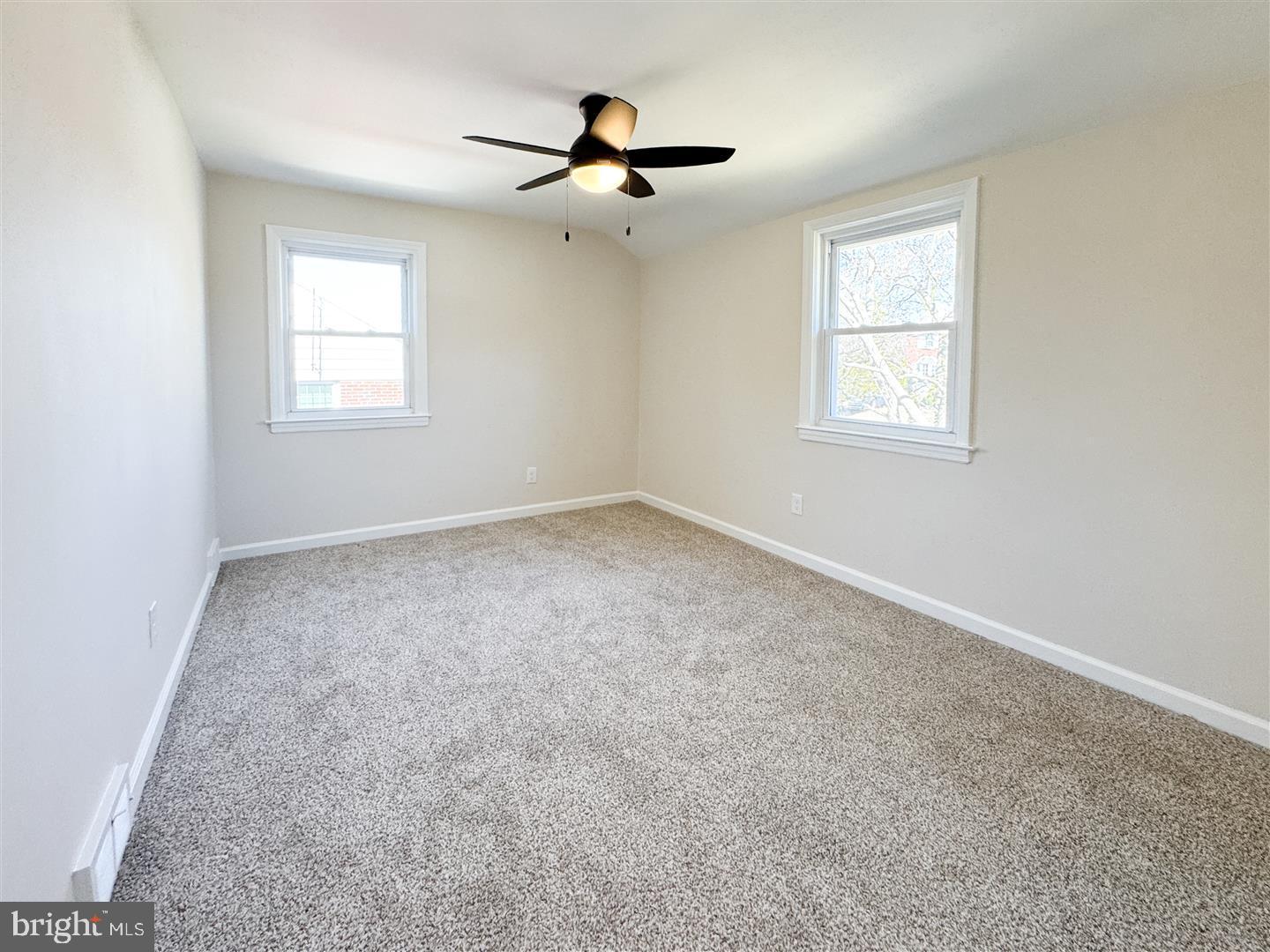 260 Gibbons Road Springfield, PA 19064 - Photo 18 of 31 an empty room with ceiling fan and windows