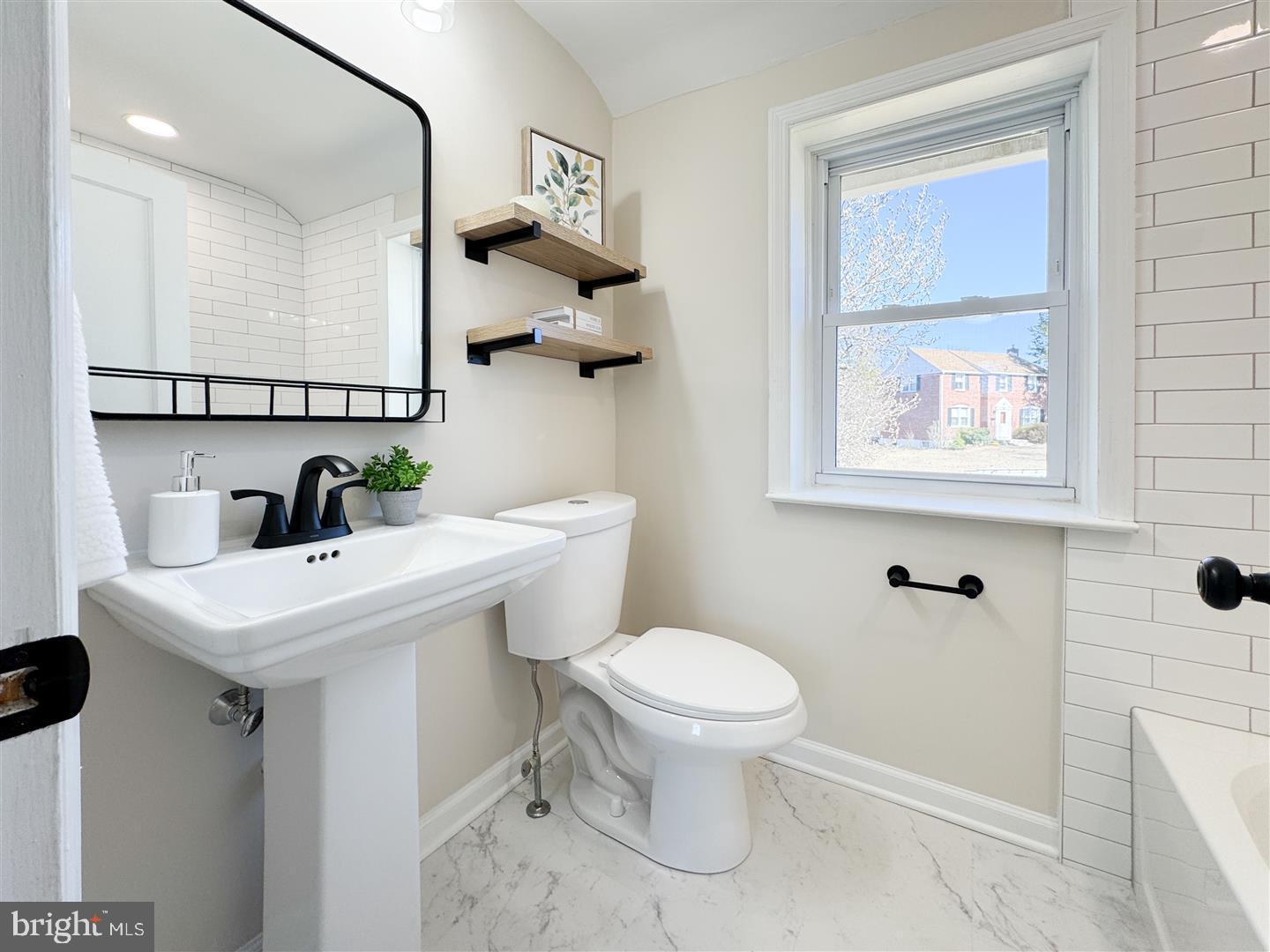 260 Gibbons Road Springfield, PA 19064 - Photo 20 of 31 a bathroom with a sink a toilet and mirror