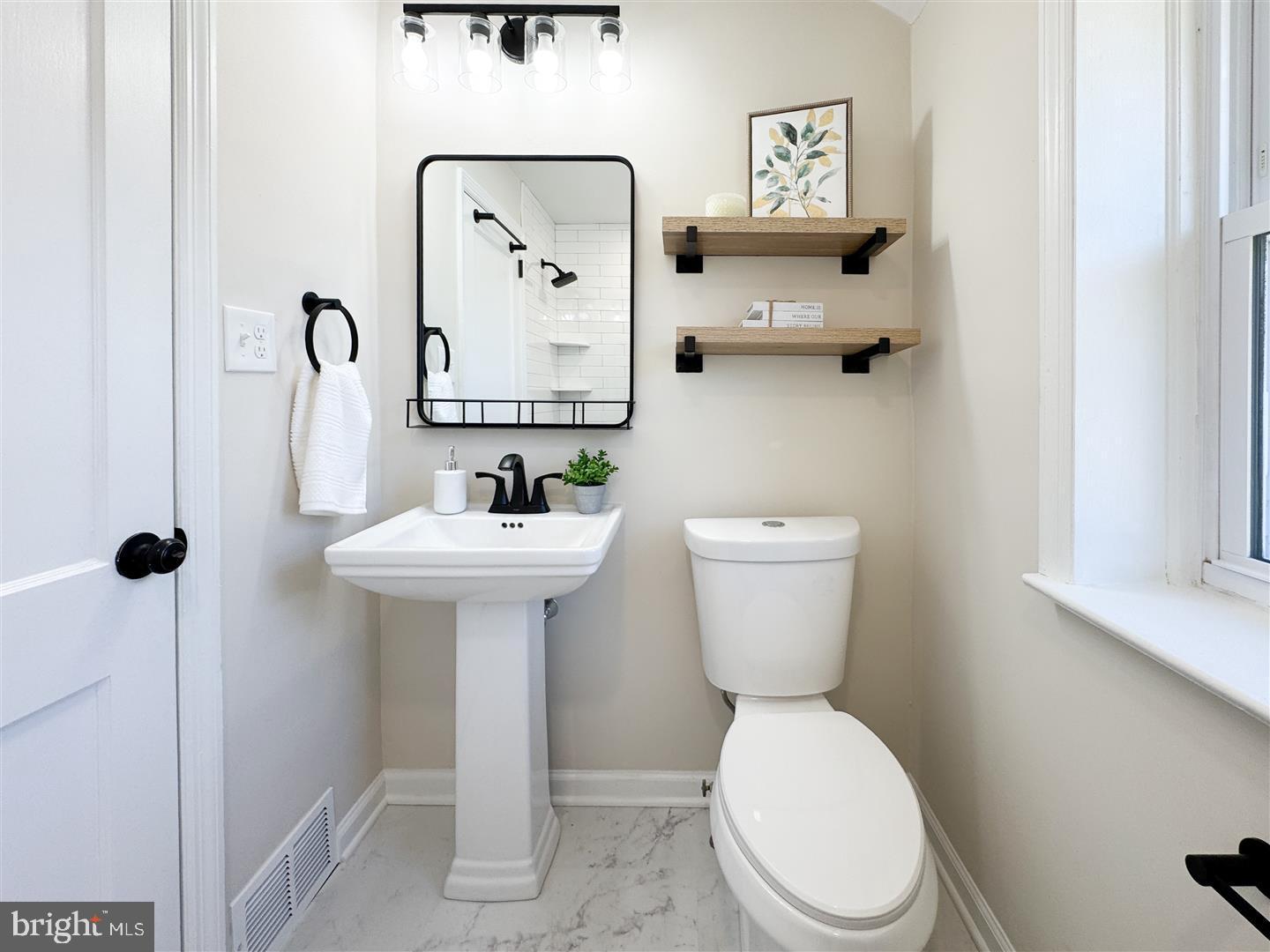 260 Gibbons Road Springfield, PA 19064 - Photo 21 of 31 a bathroom with a toilet sink and mirror