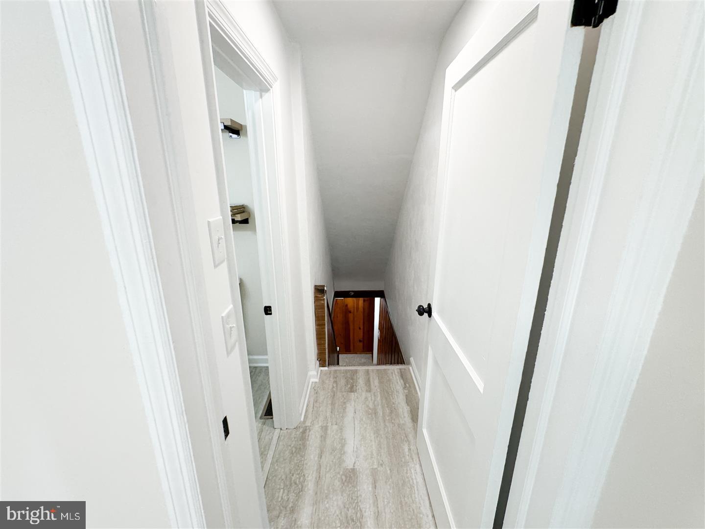 260 Gibbons Road Springfield, PA 19064 - Photo 23 of 31 a view of a hallway with wooden floor and staircase