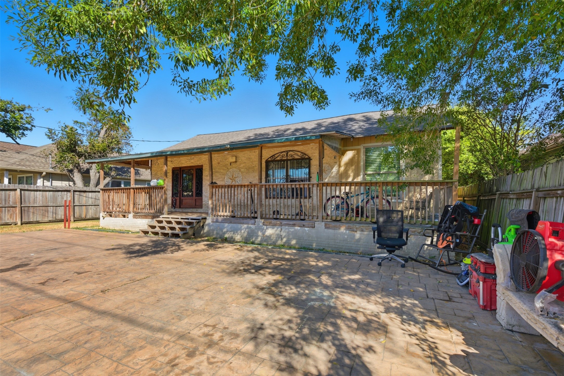 a view of a house with backyard porch and sitting area