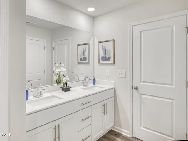 a bathroom with a sink a toilet a tub and shower