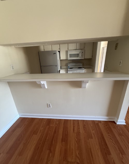 220 Elm Street, Unit 533 Clemson, SC 29631 - Photo 3 of 10 A functional kitchen layout features essential appliances and a practical breakfast bar.