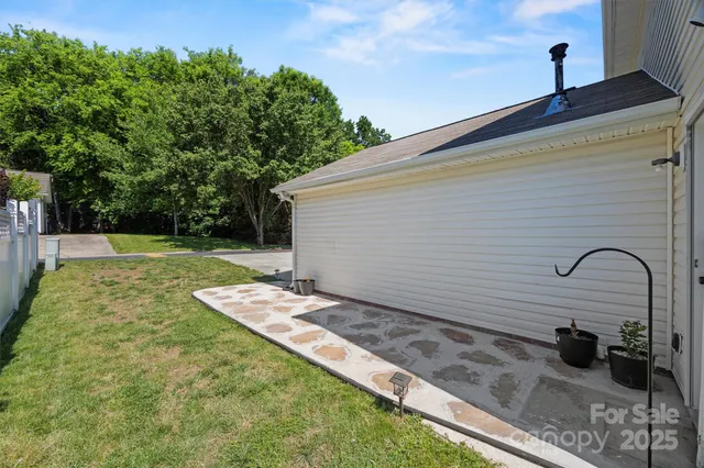 a backyard of a house with seating space