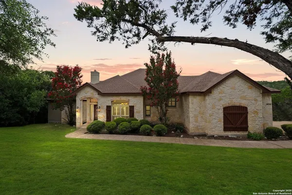 a front view of house with yard and green space