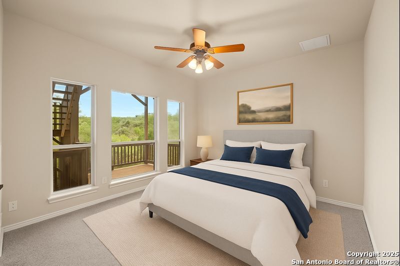 14041 Iron Horse Way Helotes, TX 78023 - Photo 24 of 49 a bedroom with a large bed and a window