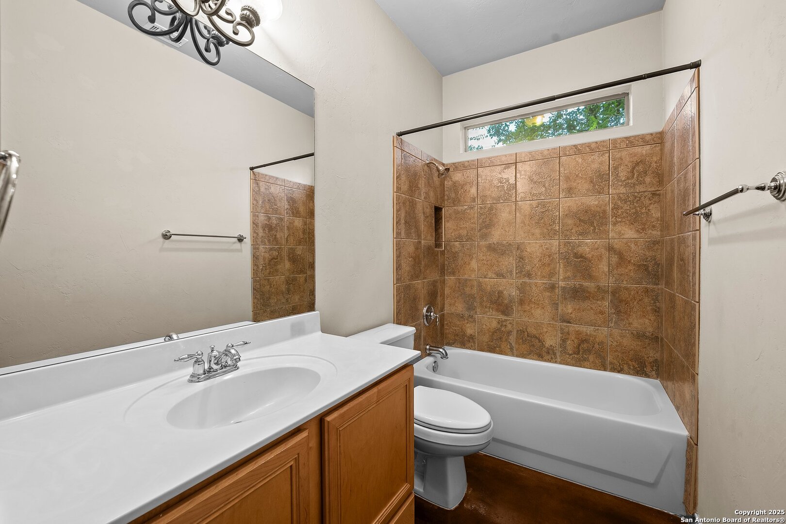 14041 Iron Horse Way Helotes, TX 78023 - Photo 26 of 49 a bathroom with a sink a toilet and shower