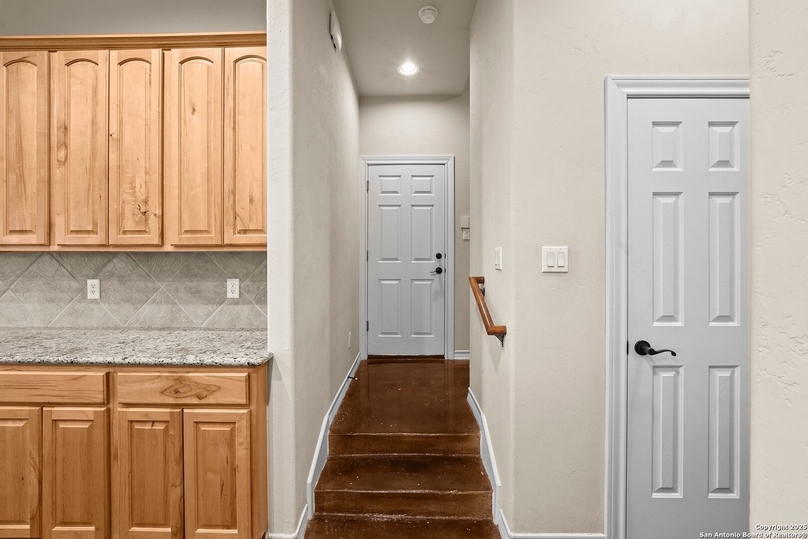 14041 Iron Horse Way Helotes, TX 78023 - Photo 30 of 49 a view of a hallway with wooden floor and staircase