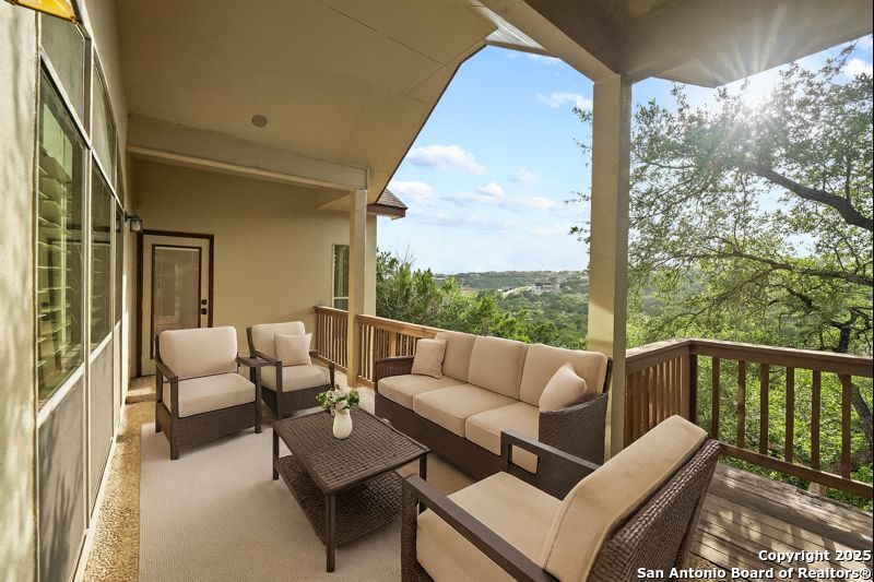14041 Iron Horse Way Helotes, TX 78023 - Photo 3 of 49 a balcony with furniture and a view of balcony