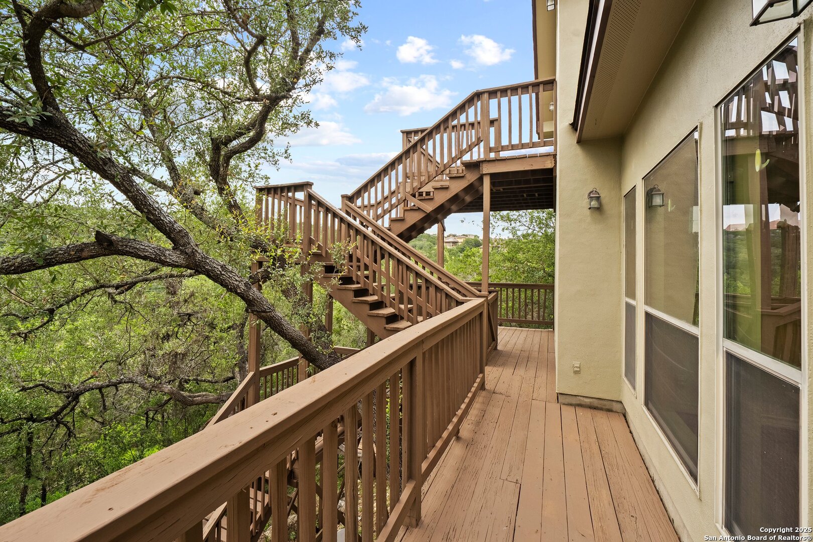14041 Iron Horse Way Helotes, TX 78023 - Photo 34 of 49 a view of balcony with wooden floor and fence