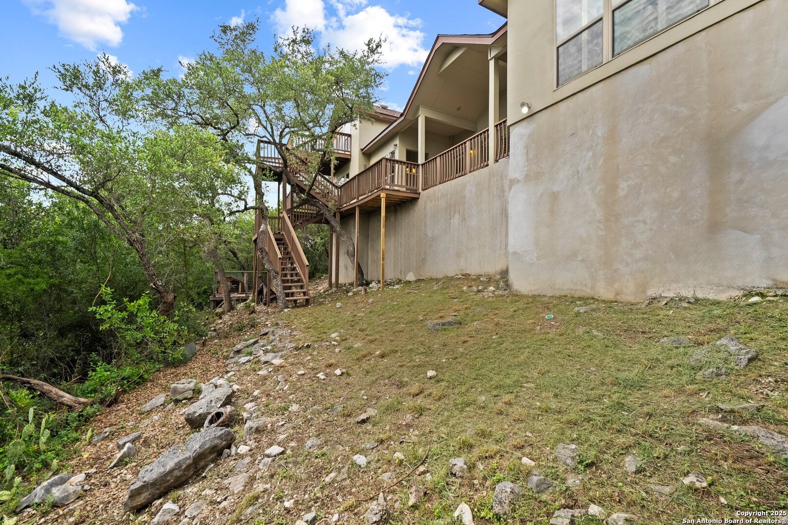 14041 Iron Horse Way Helotes, TX 78023 - Photo 35 of 49 a backyard of a house with lots of green space