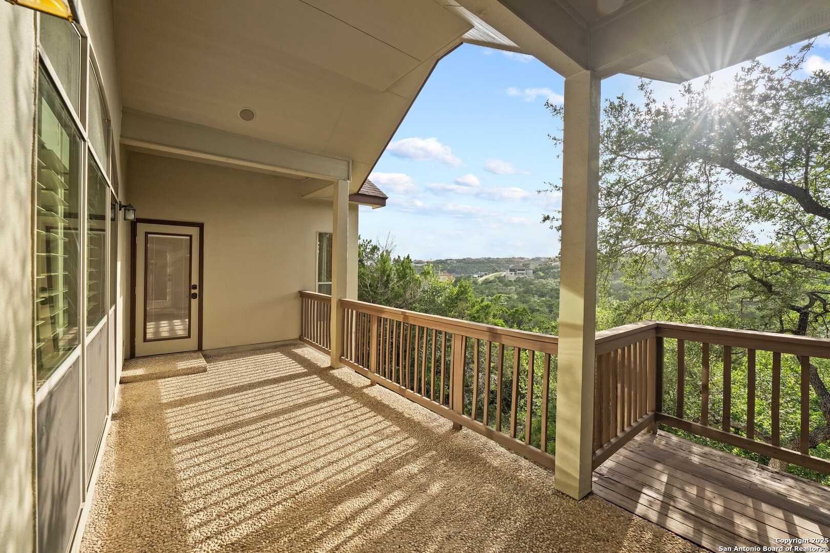 14041 Iron Horse Way Helotes, TX 78023 - Photo 4 of 49 a view of a balcony with wooden floor